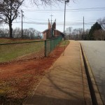 Photo Caption: Today the school principal approached me in the parking lot and mentioned she would like wildflowers in front of the school as well. This strip between the sidewalk and ball field would be ideal.